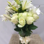 White Grace white lilies in glass vase by RosaBella Flowers