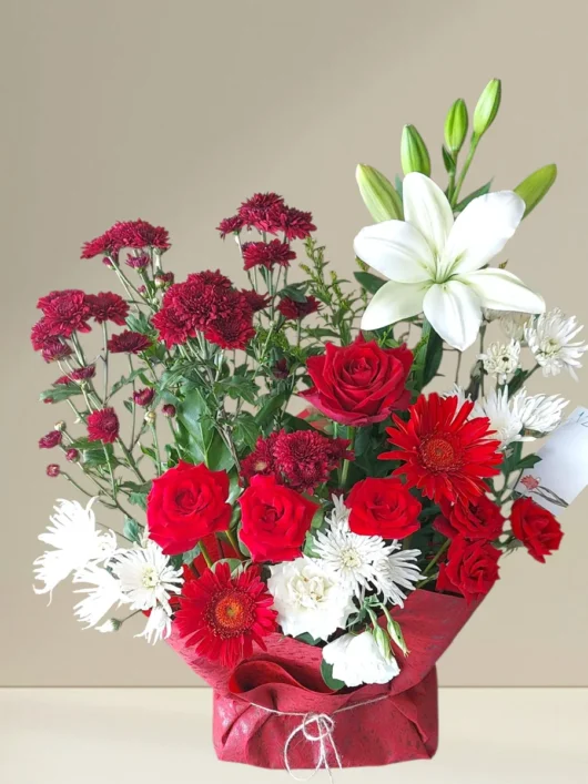 Ruby Affair red roses arrangement by RosaBella Flowers