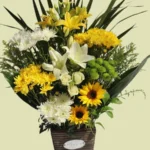Sunrise Basket yellow flower arrangement by RosaBella Flowers