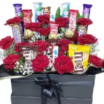 Sweet Indulgence flowers and chocolate basket by RosaBella Flowers