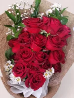 Rosabella Rouge red roses bouquet in linen wrap by RosaBella Flowers